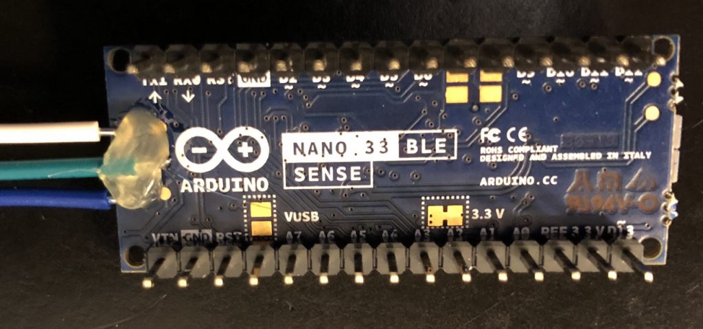 Hot glue applied to secure the wires